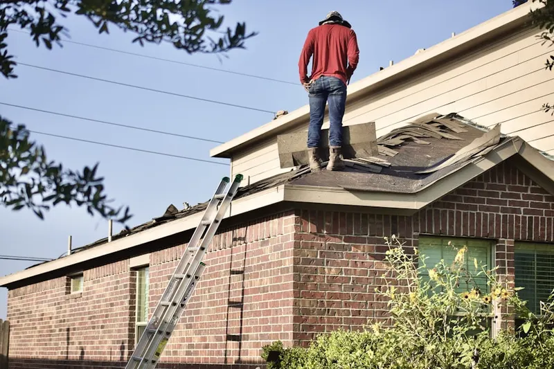Professional roofer working on a residential roof in Katellen